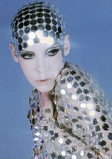 candypriceless:  Peggy Moffitt in Rudi Gernreich, nude chiffon jumpsuit paved in mirrors with mirrored skullcap, 1969 – Photo © William Claxton 