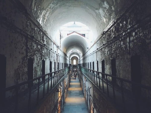 Thrust into the middle of urban Philadephia is what looks like a great castle, a massive and haunting building. Opened in 1829, Eastern State was designed as a new type of prison where order reigned, the world’s first penitentiary. Inmates were...