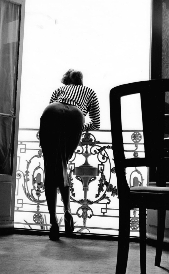 Sophia Loren looking out at the sea from her room in the Carlton Hotel. Cannes Film Festival 1955