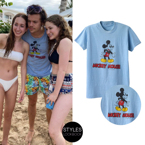 styleslookbook: Out in Anguilla, Harry was pictured wearing a vintage Mickey Mouse T-shirt in blue. 