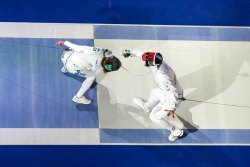 modernfencing:  [ID: a shot from above of two epee fencers hitting each other.] Fencing at Junior Worlds 2016! 