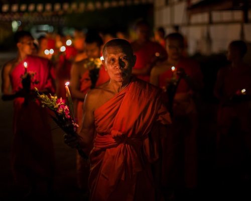 After the sun has set, in the quiet streets of Vientiane, one...