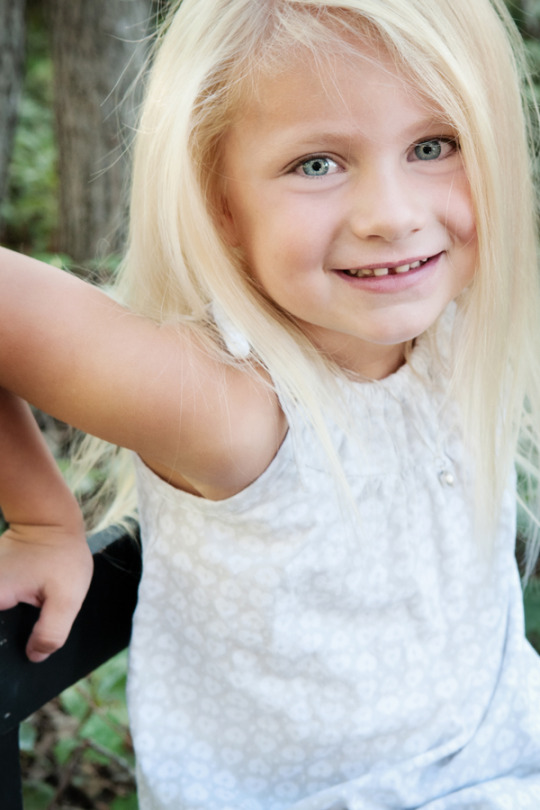 Little girl with blonde hair blue eyes