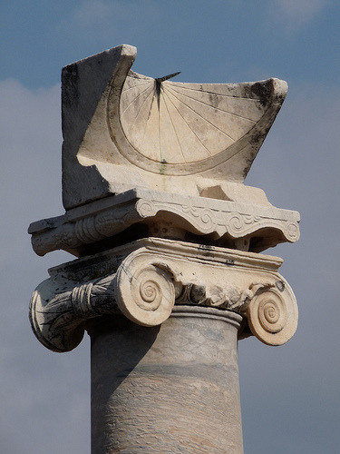 Roman sundial on top of an Ionic column in the Temple of Apollo, Pompeii, Italy. 79 AD