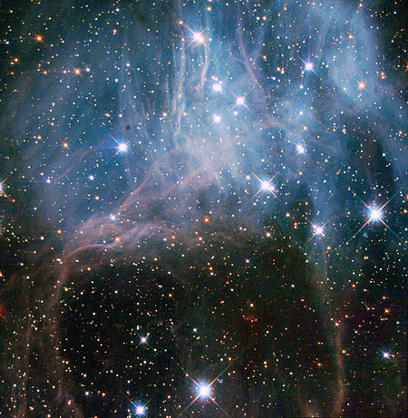 Stars in the cosmic haze: NGC 2040 © Hubble