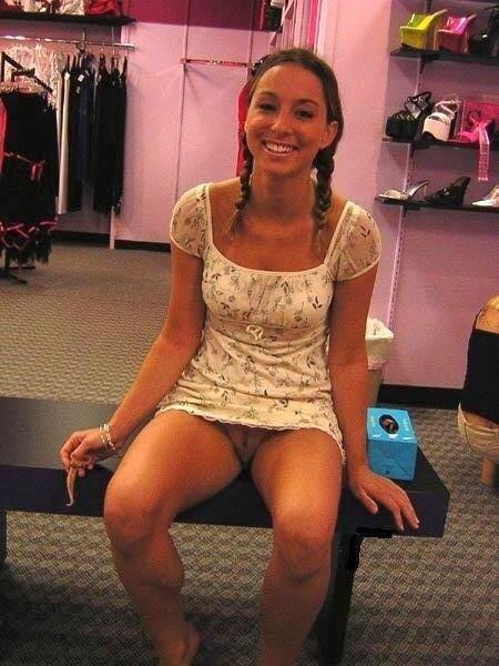 carelessinpublic:Sitting inside a shoe shop in a short dress and showing her pussy