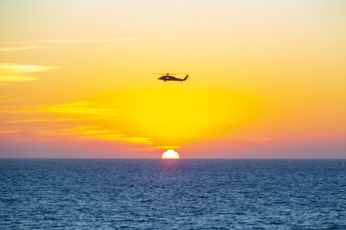 Sun meets sea….PACIFIC OCEAN (October 29, 2020) – An MH-60S Sea Hawk helicopter on its way bac