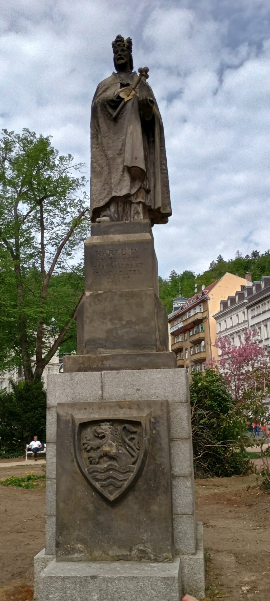 Statue Of Czech King Karel IV In Karlovy Vary With Bohemian Coat Of Arms. Words Says: Karel IV. Czech