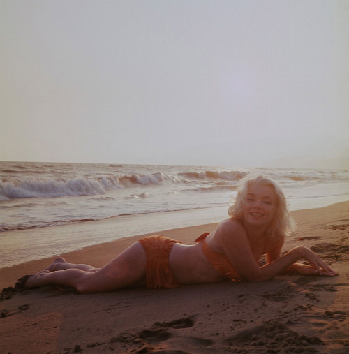 Marilyn Monroe photographed by George Barris on Santa Monica beach, July 1962.