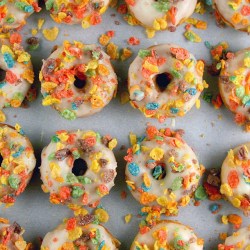 bakeddd:  fruity pebble frosted doughnuts click here for recipe 