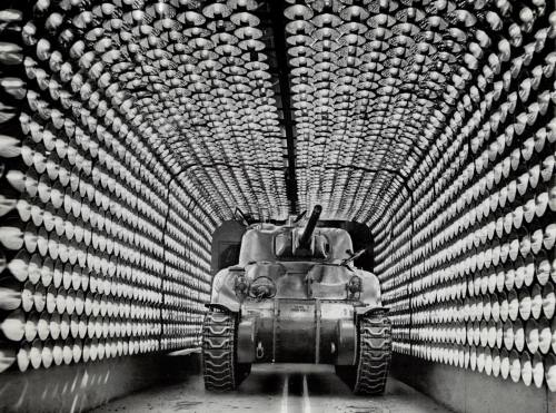 A freshly painted M4 Sherman Tank in an infrared lamp tunnel ,which is designed to cut the drying ti