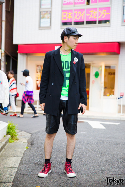 Kyohei on the street in Harajuku wearing a vintage blazer with leather shorts, a leather newsboy hat