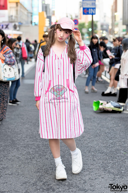 Japanese street style icon Mico on the street in Harajuku wearing vintage Esleep with a NY cap and T