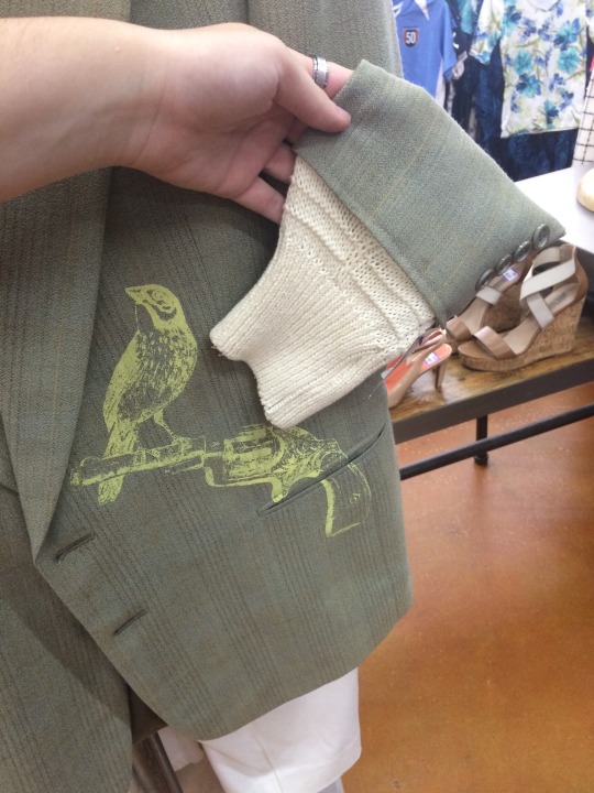 arodudejude:  arodudejude:  arodudejude:  looK AT THIS AWFUL JACKET I FOUND IT AT GOODWILL AND IT’S THE MOST GOD-AWFUL GARMENT I HAVE EVER LAID EYES ON LOOK AT THIS IT’S GOT A BIRD WITH A GUN PRINTED ON THE SIDE THERE ARE SWEATER SLEEVES ON THE ENDS