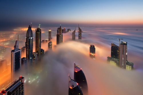 nubbsgalore:  photos from dubai’s 828 meter tall burj khalifa (save the first and last photos, which show the building) by (click pic) daniel cheong, karim nafatni, bjoern lauen and dave alexander. duabai only experiences this in september and march,