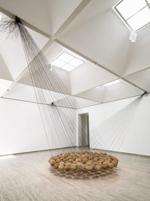 onpyre:Ken Unsworth. Suspended stone circle II103 river stones, wire. 400.00 cm diam. overall