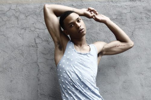 handsome black boy model posing in retro muscles-shirt