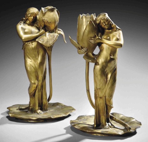 Pair of figural candlesticks.c.1900. Gilt bronze, each modelled as a maiden, one embracing an iris, 