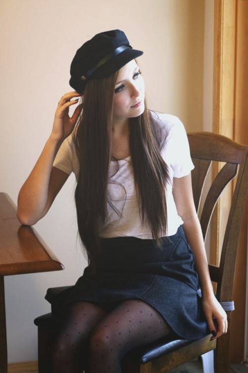 Breanne in black sheer polka dot tights, black skirt, white t-shirt and newsboy cap