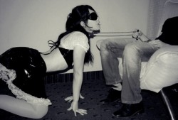 Submissive girl on her knees
