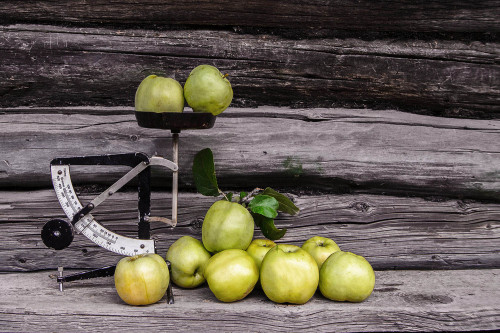 Still life with apples and old letter scales