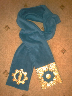 tavington:  For those familiar with the series today’s make is a Thief 2: The Metal Age- Mechanist scarf!  Lovely shiny gold gears embroidered on dark teal fleece.  Also a great steampunk accessory :)  I’ve been meaning to make this scarf for such