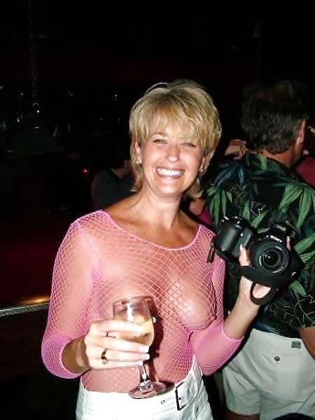 carelessnaked: Milf in a transparent dress inside a bar
