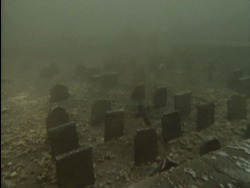 unexplained-events:An underwater graveyard in Llyn Celyn, Wales. The village it was located in was flooded in the 60’s to supply water to Liverpool.
