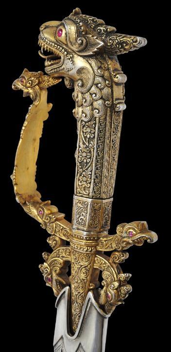 Sri Lankan silver and gold gilt kasthane sword set with red stones, 19th century.from Michael Backma