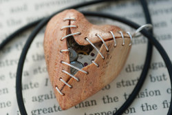 wickedclothes:  Stitched Clockwork Heart Pendants Sometimes our hearts get ripped apart at the seams. Luckily, time heals all wounds. Carved out of various woods, these heart pendants are filled with old watch parts. Sold on Etsy. 