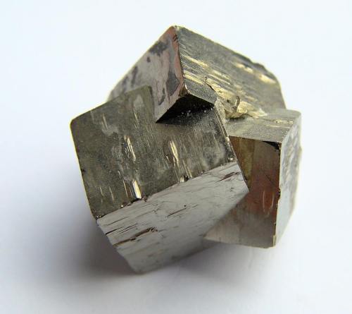 Three interpenetrating pyrite cubes Many crystals are not the single orderly arrangement that one mi