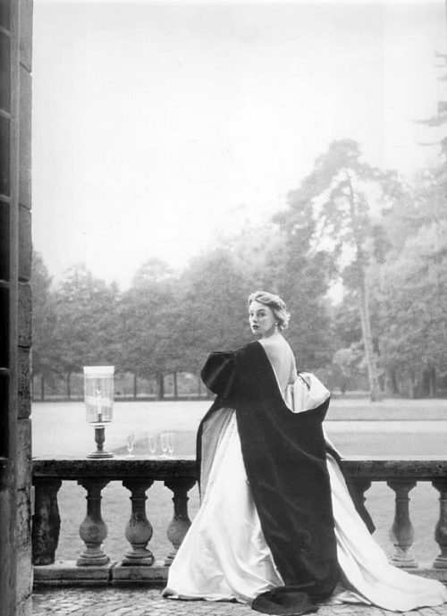 wehadfacesthen - Model wearing a Givenchy gown and cape in a 1952...