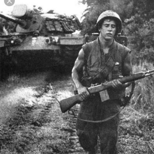 warhistoryonline:US Marine in Vietnam with an M14 rifle followed by a M48A3 Patton MBT wrhst