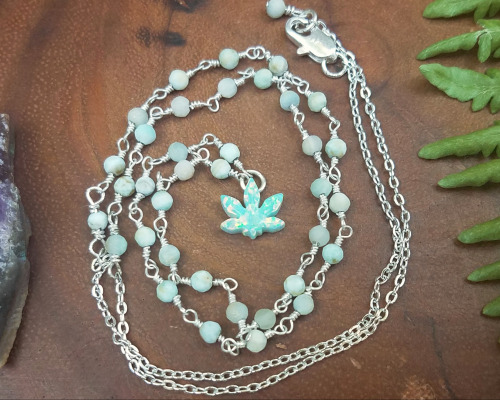 foxstonejewelry:Synthetic opal weed leaf necklace with larimar available on Etsy.  Instagram | Shop