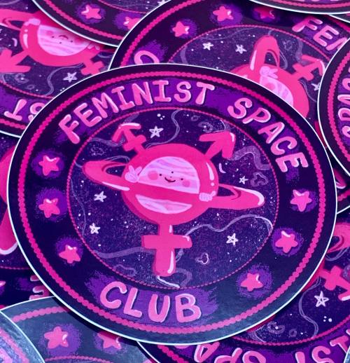 I want to Believe Art by Liberal Jane[Circle sticker that reads, ‘feminist space club’ i