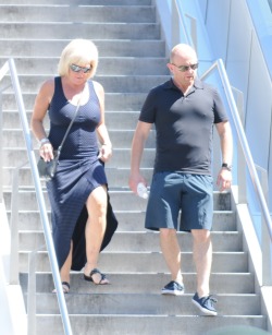 Large braless breasts dancing down the stairs.