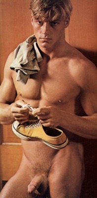 bobsnakedguysblog:  David Keith in Playgirl, trying to get the knot out of his Converse laces. 