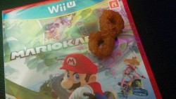 sukoshibot: after spending all day considering getting mariokart 8, I went to burger king for dinner and to my surprise found this onion ring. Not only is it shaped like an 8, but it was the only onion ring in my bag since I ordered fries. now i’m not