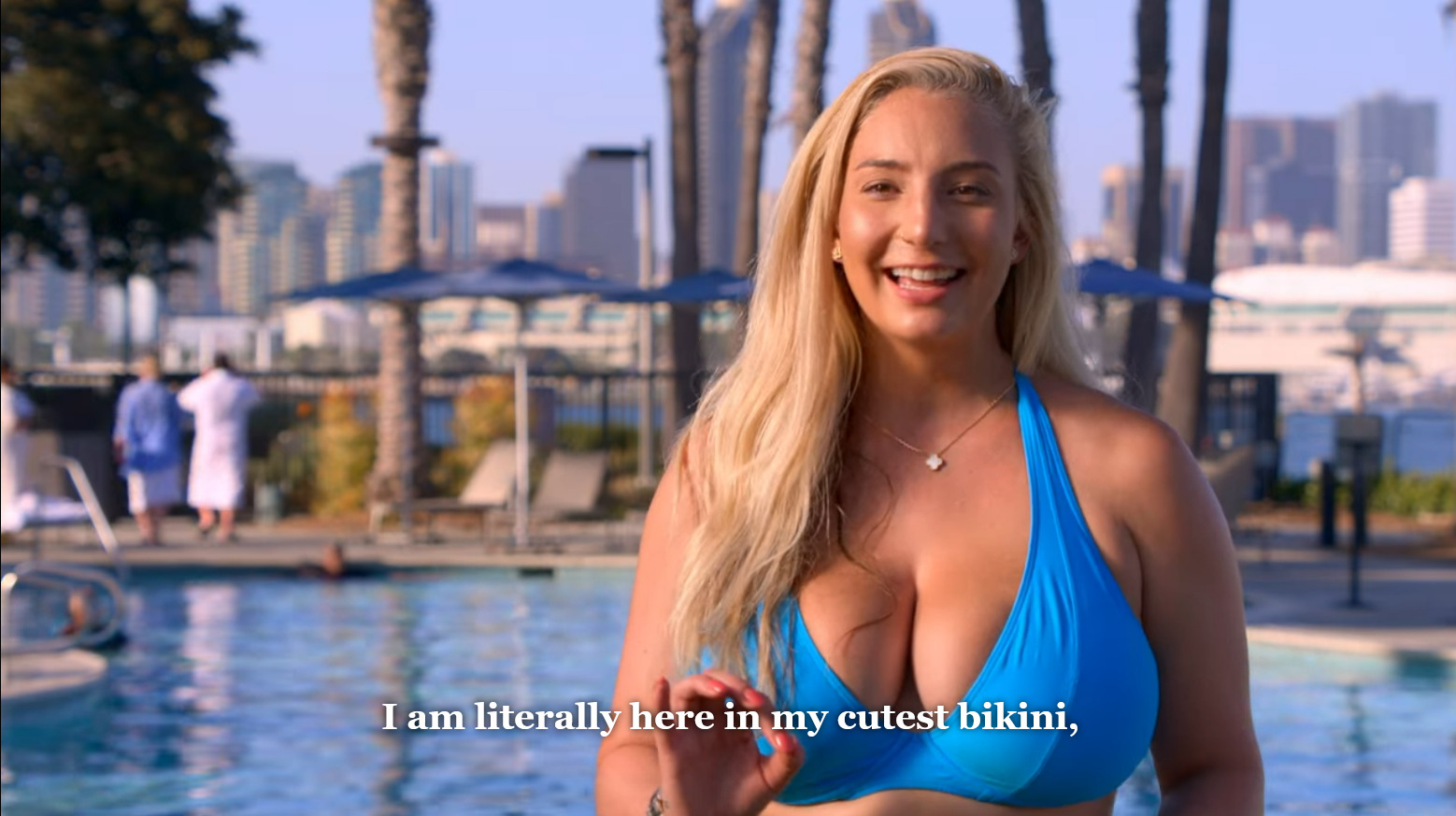 Lexi stands in front of the pool in a revealing swimsuit, saying "I am literally here in my cutest bikini."