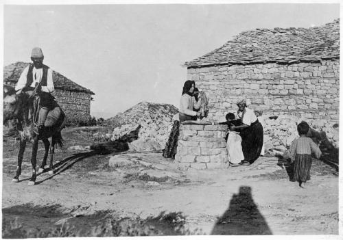 Villagers around a well in Albania - (MAP archives)