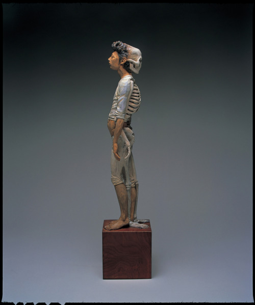 sixpenceee:  The bizarre art of Yoshitoshi Kanemaki. He chisels these life-sized figurative sculptures out of giant pieces of camphor wood, a kind of evergreen. The strange pieces frequently involve two or more characters merged into a single form, which