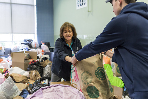 Needham residents gather donations for Cradles to Crayons at Needham High School on April 7, 2018.