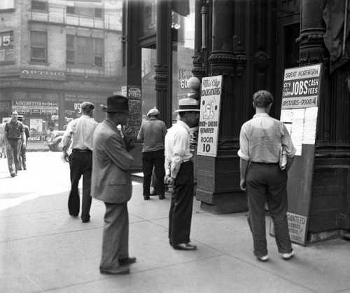 Looking at opportunities at the Great Northern Employment Bureau, 601 W. Madison, July 1937.
