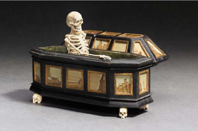 sixpenceee:  A momento mori of a 17th century ivory skeleton in an ebonized wood