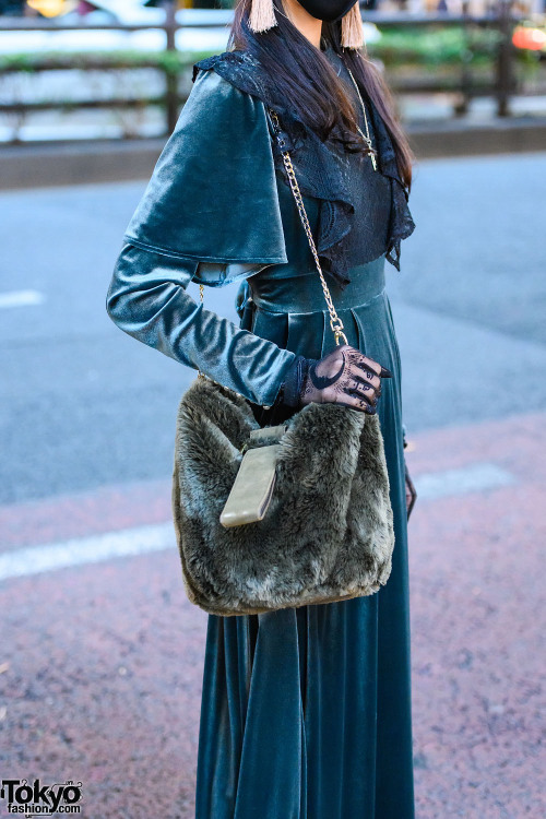 18-year-old Japanese student Mikael on the street in Harajuku wearing a green velvet dress by Pameo 