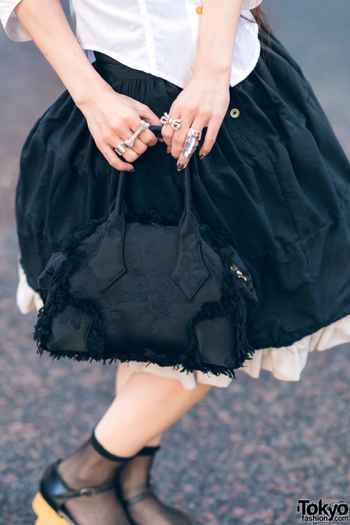 tokyo-fashion:  Married Japanese couple Kazuki and Saki - known in the Tokyo fashion scene for their shared love of Vivienne Westwood - on the street in Harajuku wearing looks by Vivienne and World’s End with jeweled devil horns, rocking horse shoes,