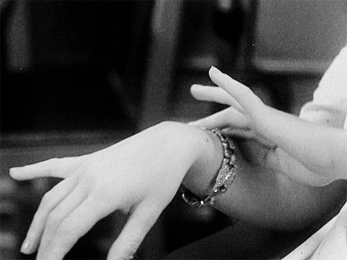Joan Blondell shows off her expensive bracelet in Blondie Johnson, 1933