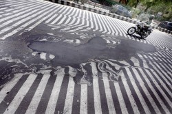 sixpenceee:  The asphalt melted in India’s heat wave. 