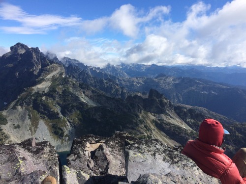 Jacob and the Cascade Crest of the Alpine Lakes Wilderness atop Chikamin Peak.