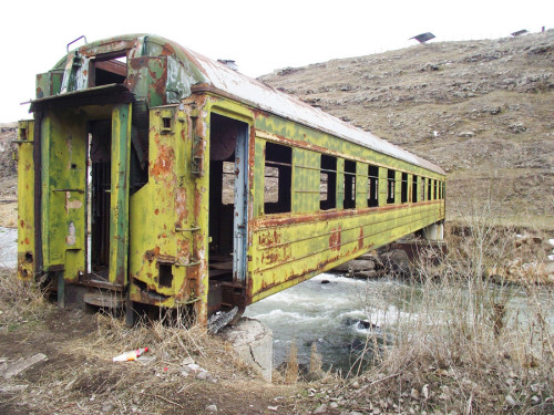 destroyed-and-abandoned:  Bridge made out of an abandoned train-car 